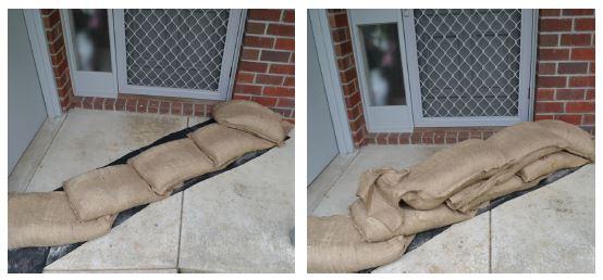 Sanbags set up to protect a front door