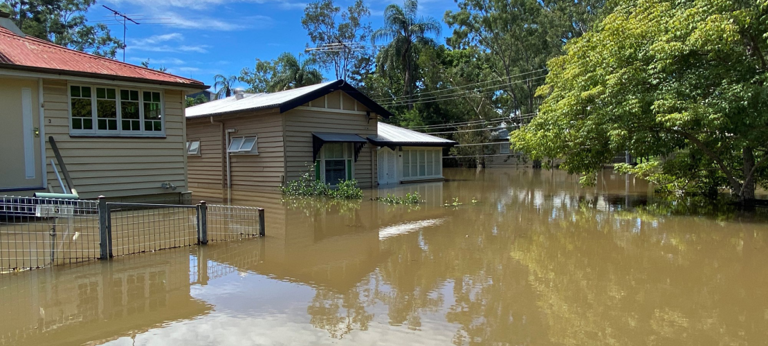 House with flood water over flooring