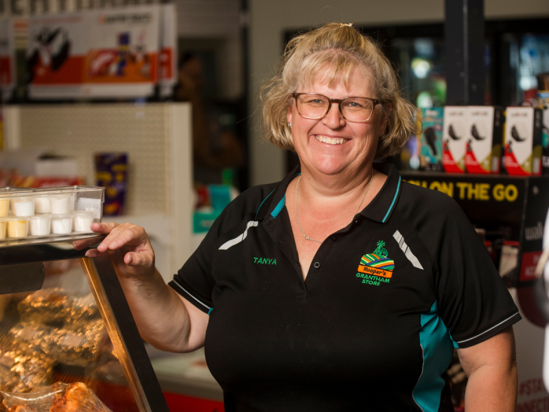 Business person in front of display